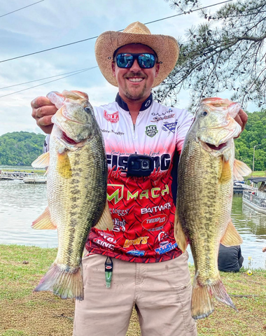 Andrew Nordbye presenting 2 large fish. Andrew’s favorite frogg toggs gear is the Hydrogrip Deck Boot.