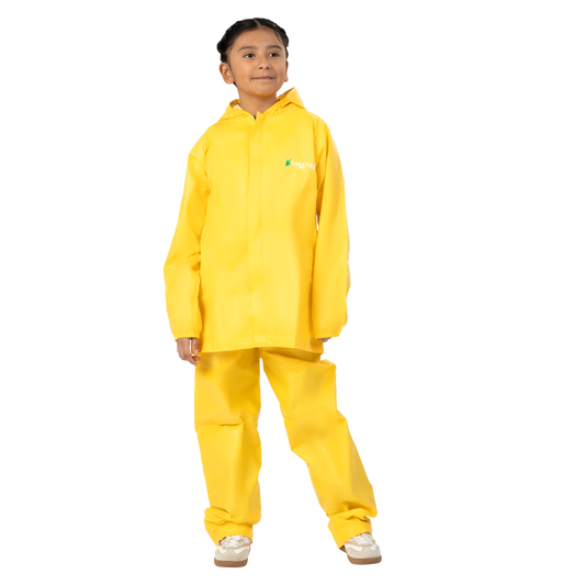Child wearing a yellow raincoat and pants on a white background