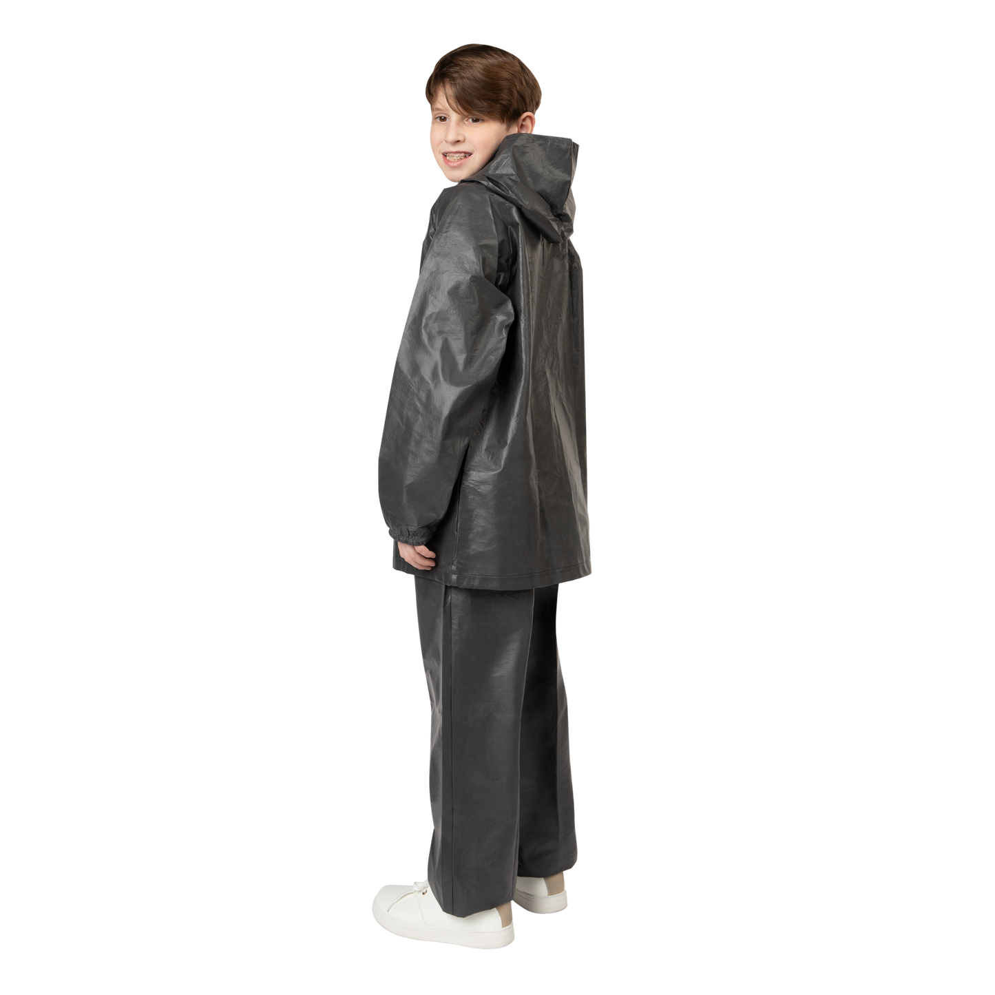 Child wearing a black raincoat and pants on a white background