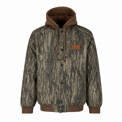A hooded jacket with a brown and green tree bark camouflage pattern, featuring a brown hood lining, brown drawstrings, and a small brown leather patch on the left chest.