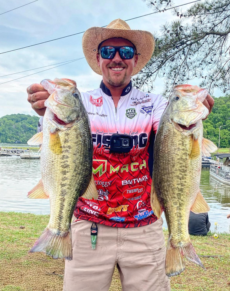 Andrew Nordbye presenting 2 large fish. Andrew’s favorite frogg toggs gear is the Hydrogrip Deck Boot.