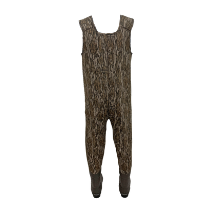 A pair of camouflage-patterned frogg toggs hunting overalls with integrated brown boots, shown against a plain white background.
