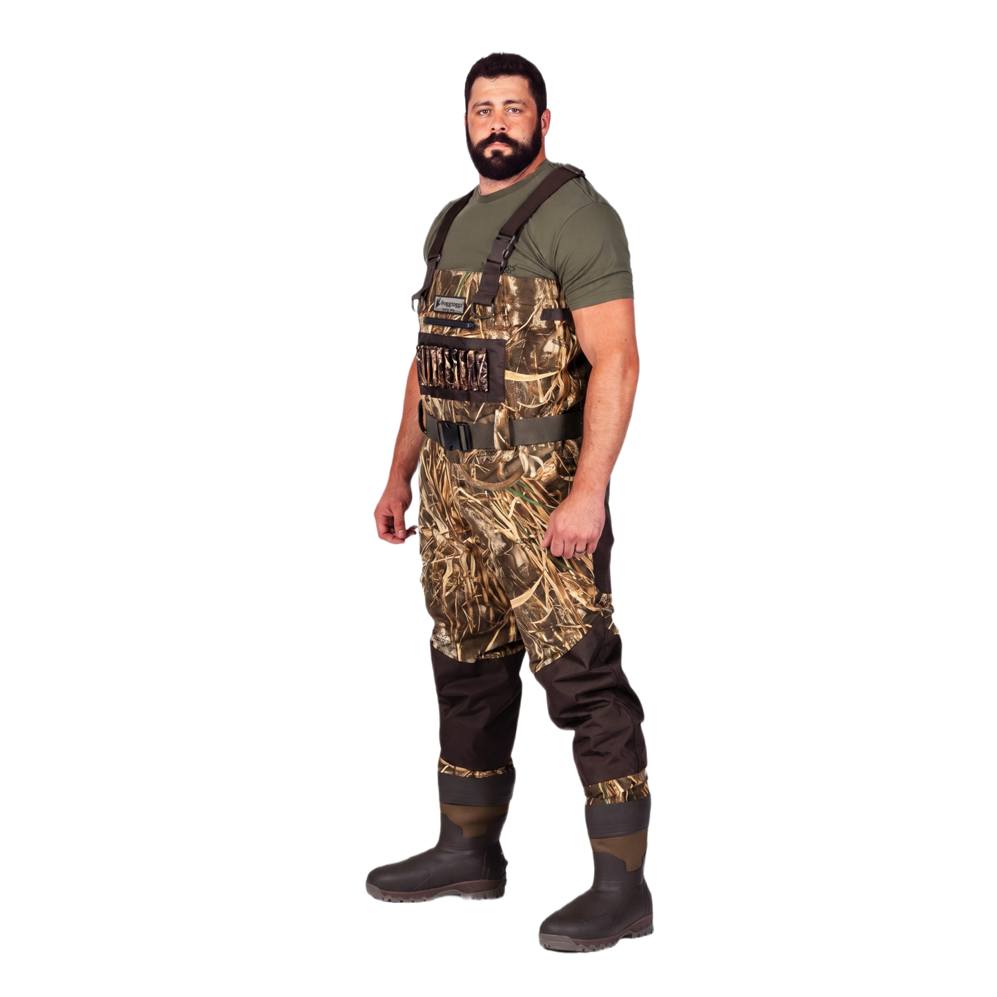 A man wearing camouflage duck waders over a green t-shirt and dark brown rubber boots, standing against a solid white background.