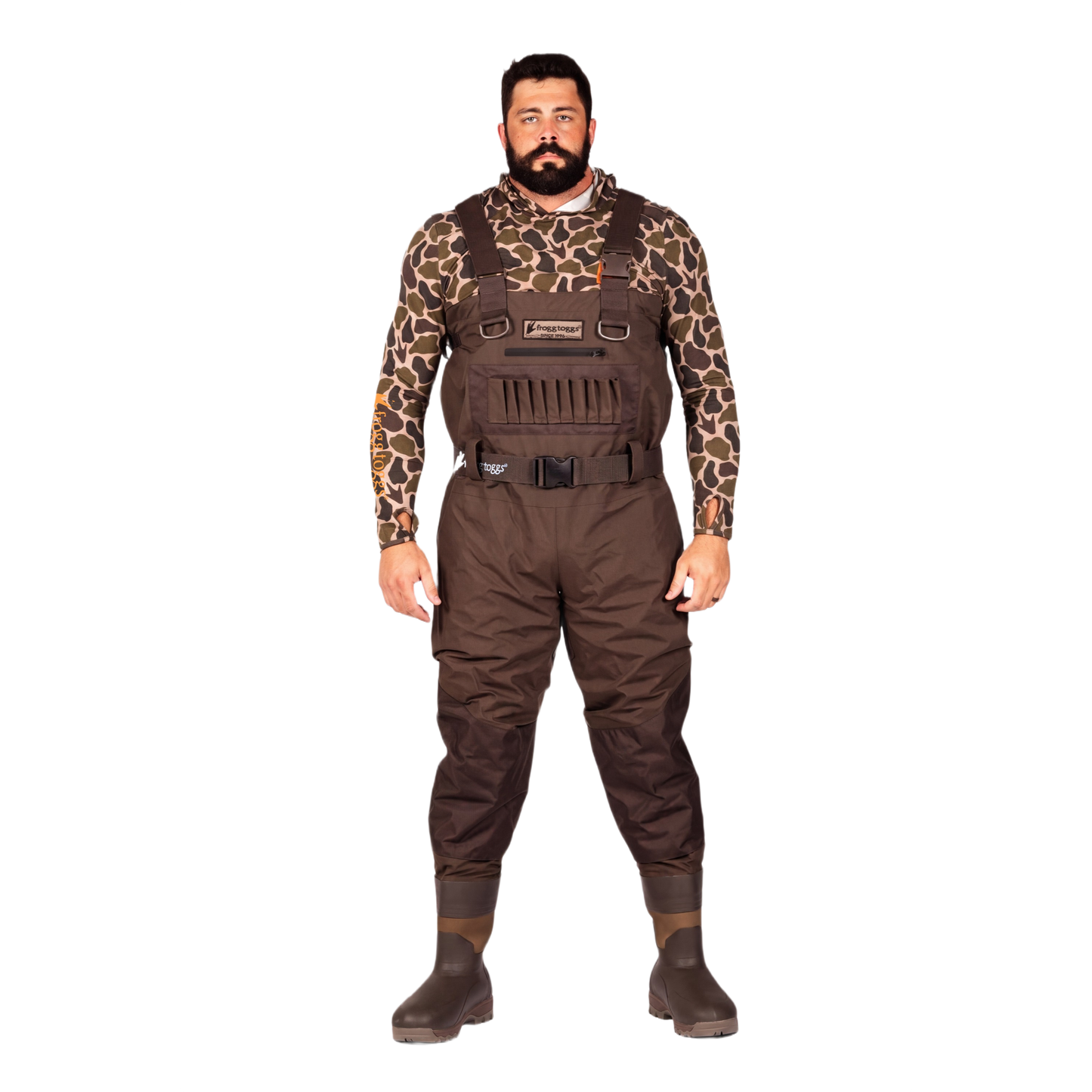 A man modeling brown waterproof waders over a brown and black giraffe-print long-sleeve shirt, standing against a solid white background.