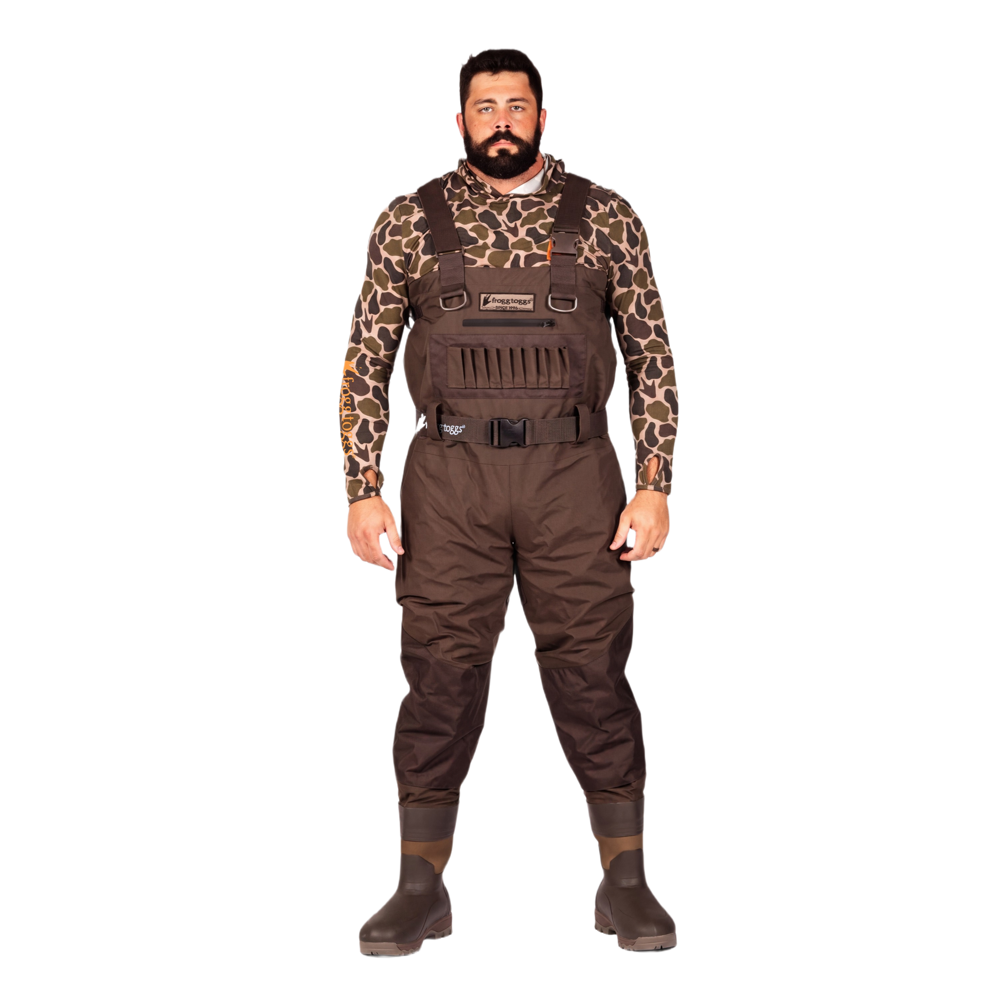 A man modeling brown waterproof waders over a brown and black giraffe-print long-sleeve shirt, standing against a solid white background.