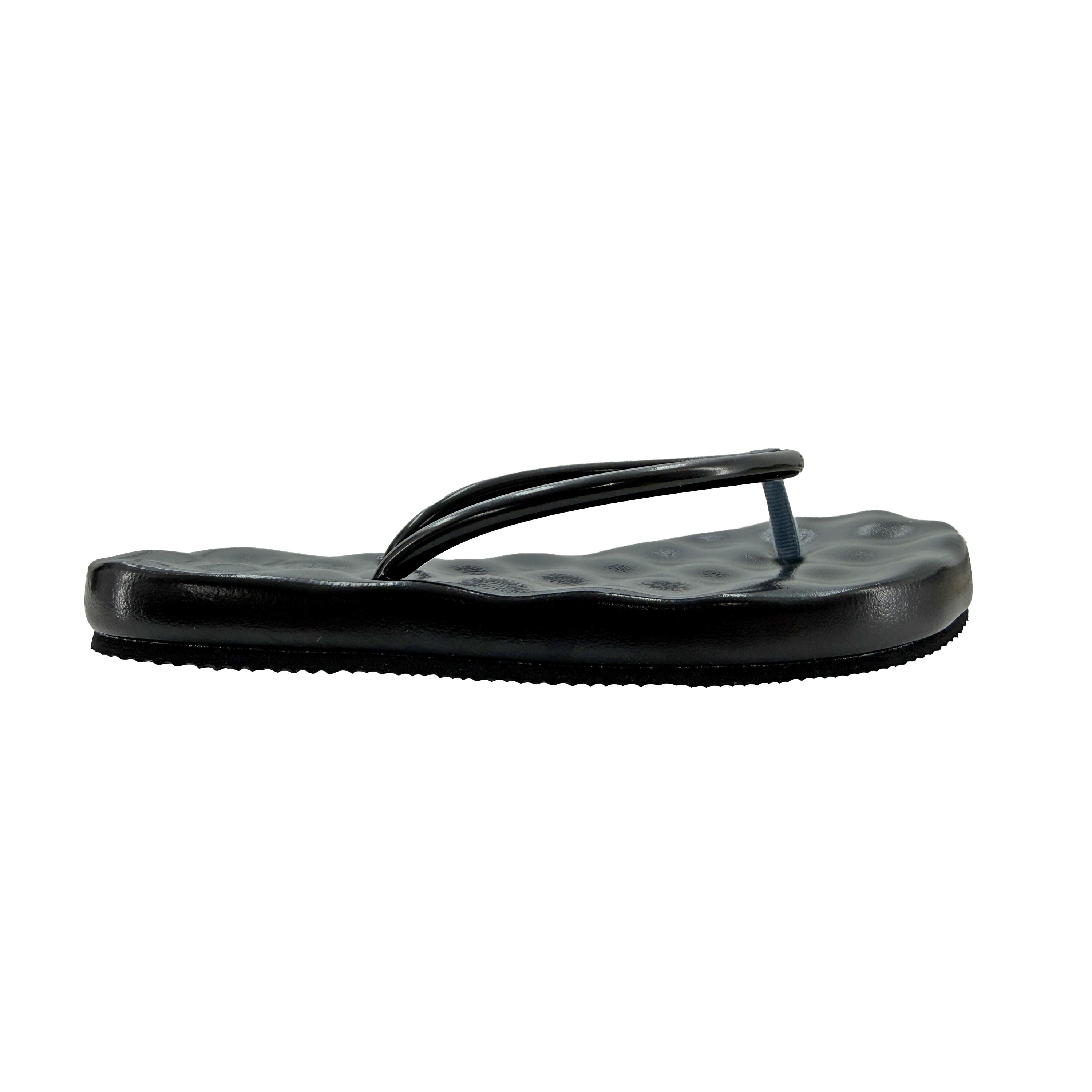 Black sandal with a textured sole on a white background