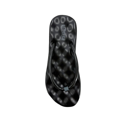 Black flip-flop sandal with a pattern on a white background