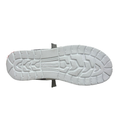 White sole of a shoe with brand logo on a white background
