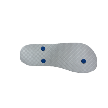 Gray shoe insole with blue dots on a white background