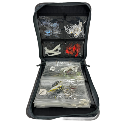 Frogg Toggs fishing lure organizer with various lures inside on a white background.