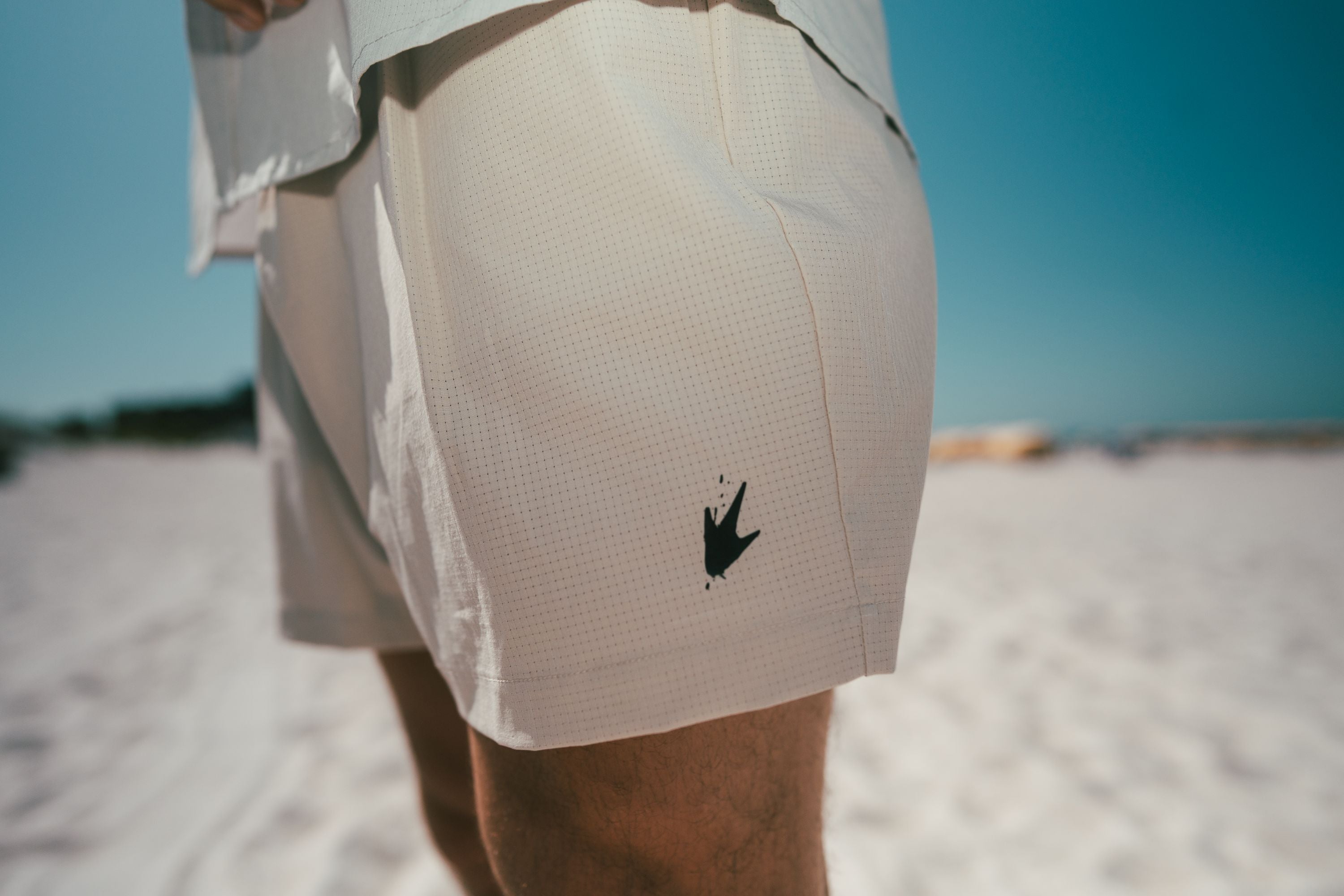 khaki short with black frogg toggs frog foot logo