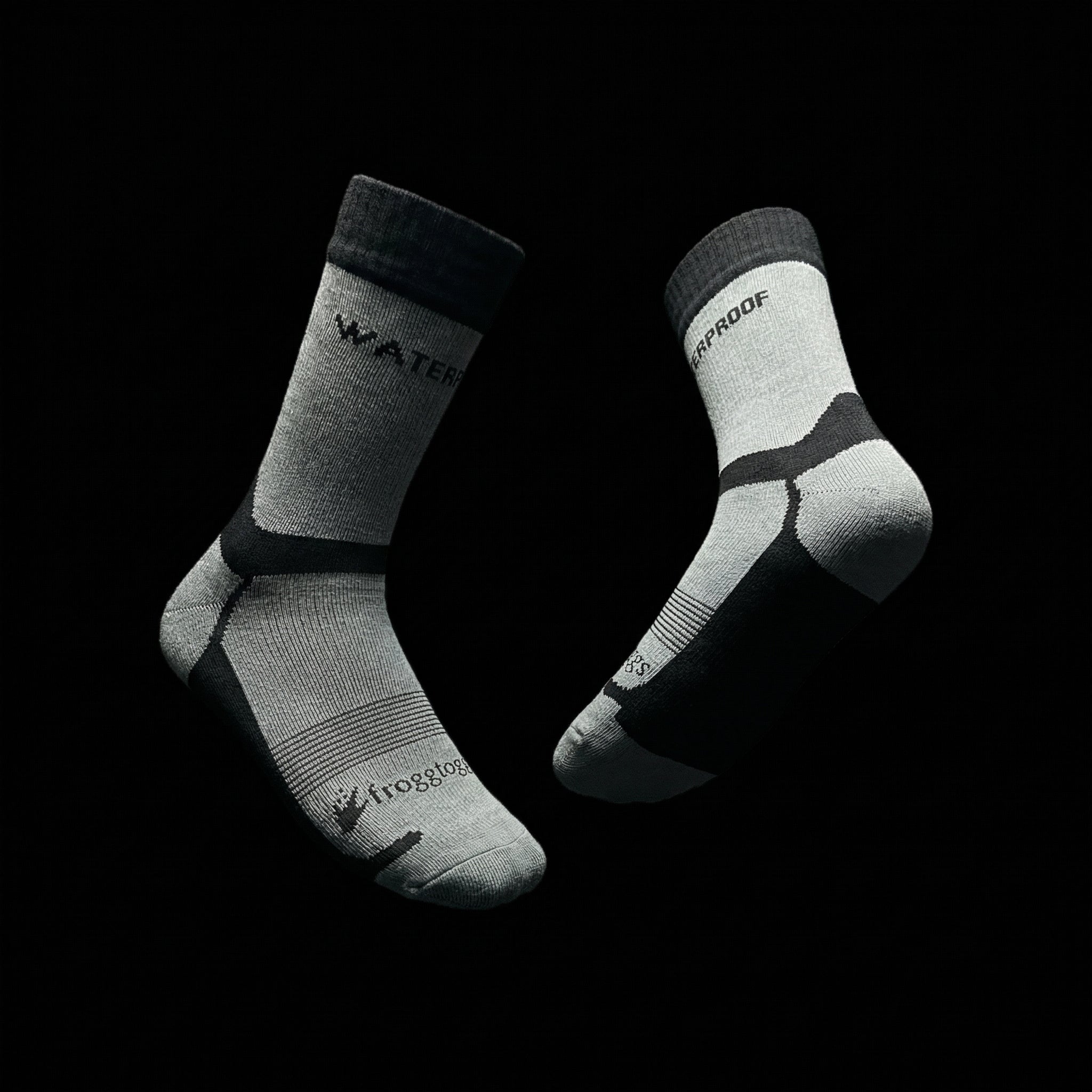 Two gray socks with text on a black background
