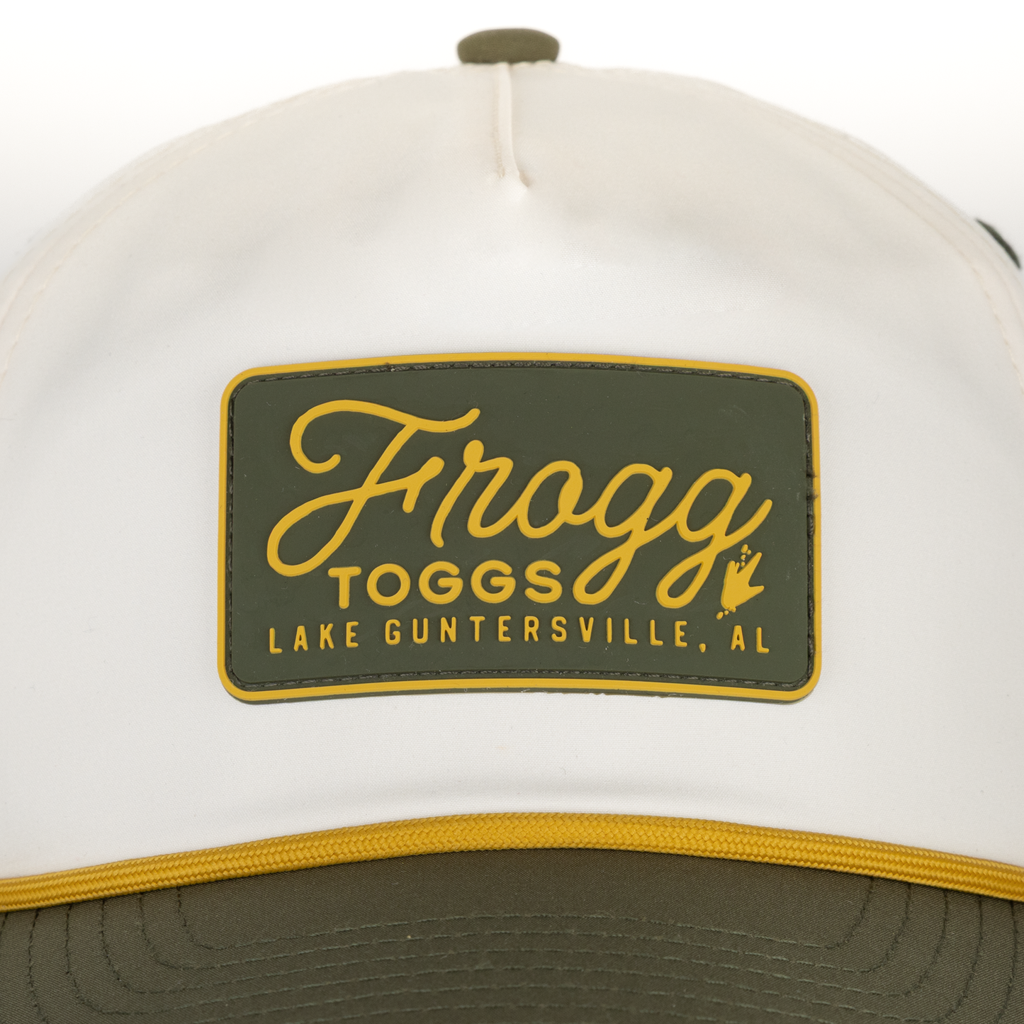 White cap with a green and yellow 'Frogg Toggs' logo on a white background