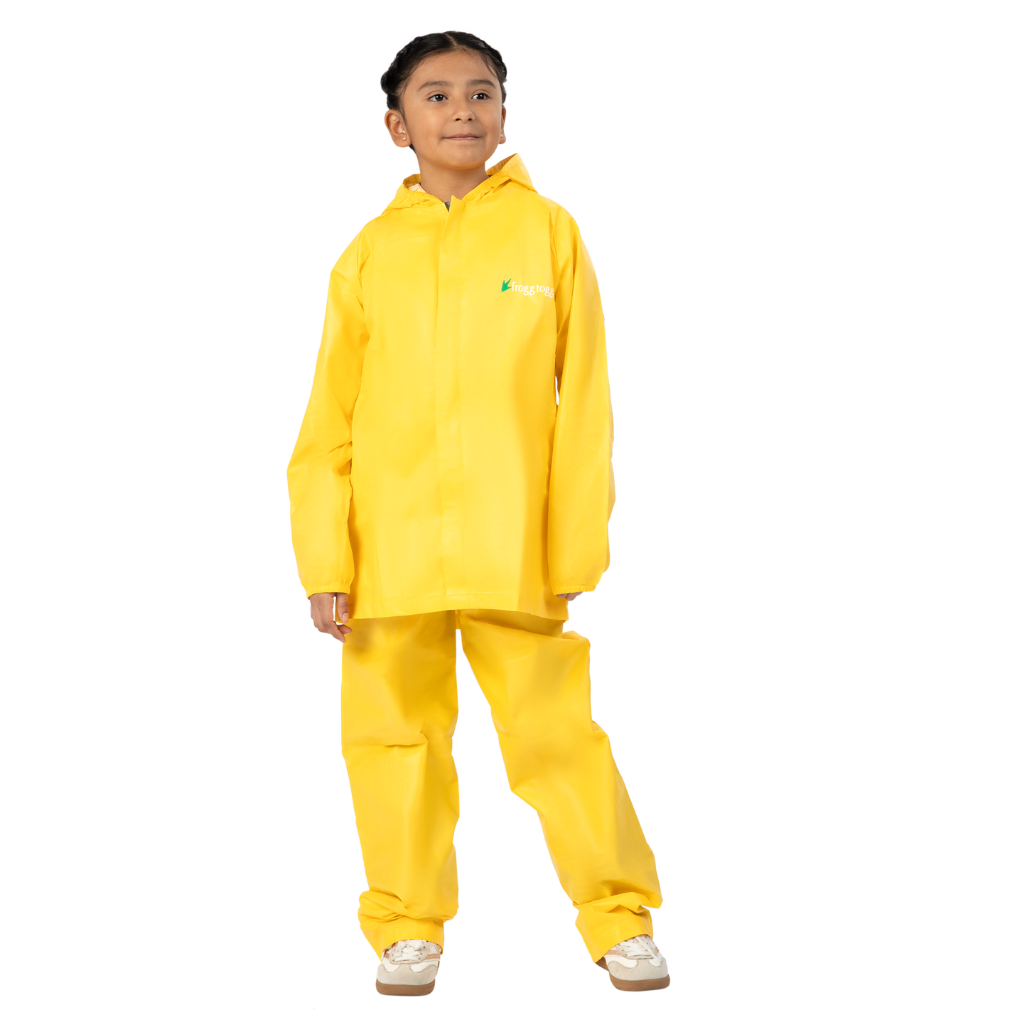 Child wearing a yellow raincoat and pants on a white background