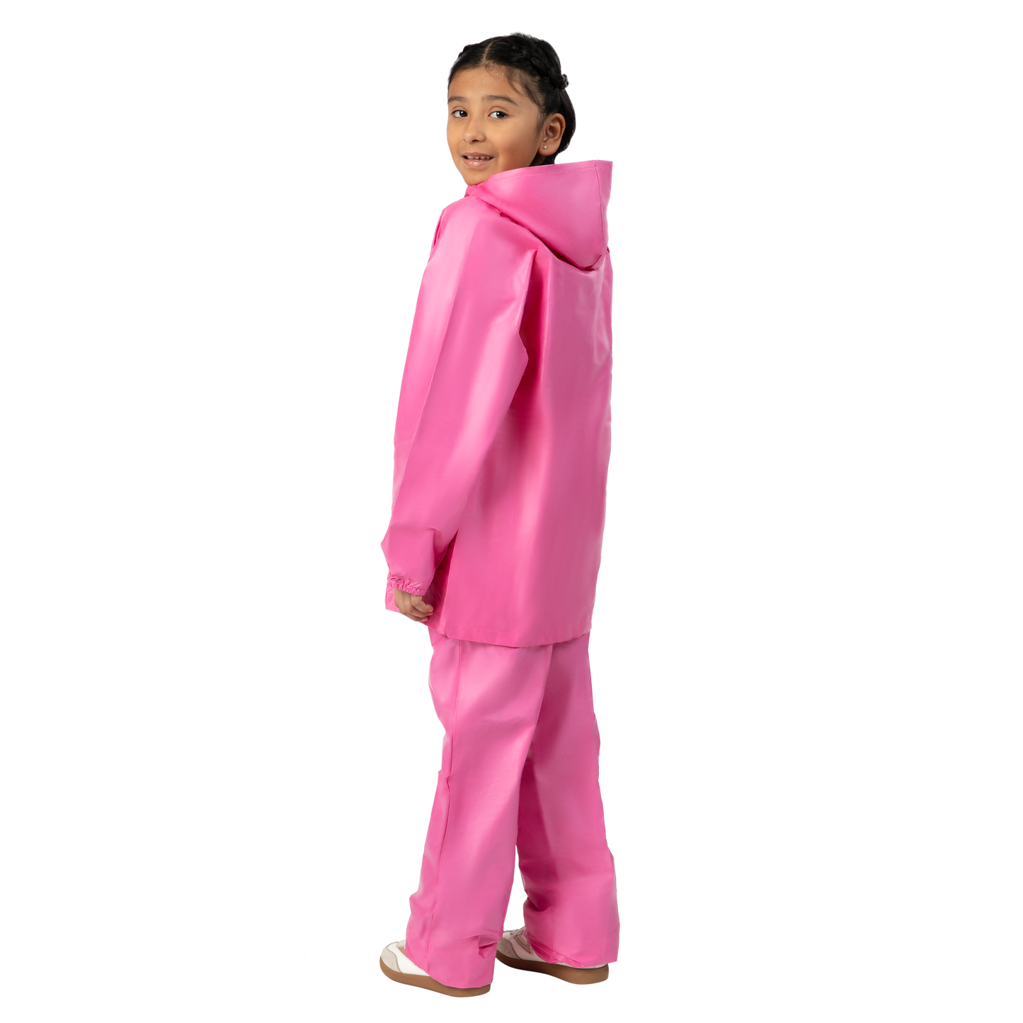 Child wearing a pink raincoat and pants on a white background