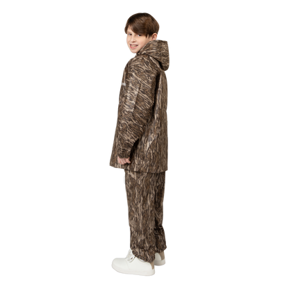Child wearing a camouflage outfit on a white background