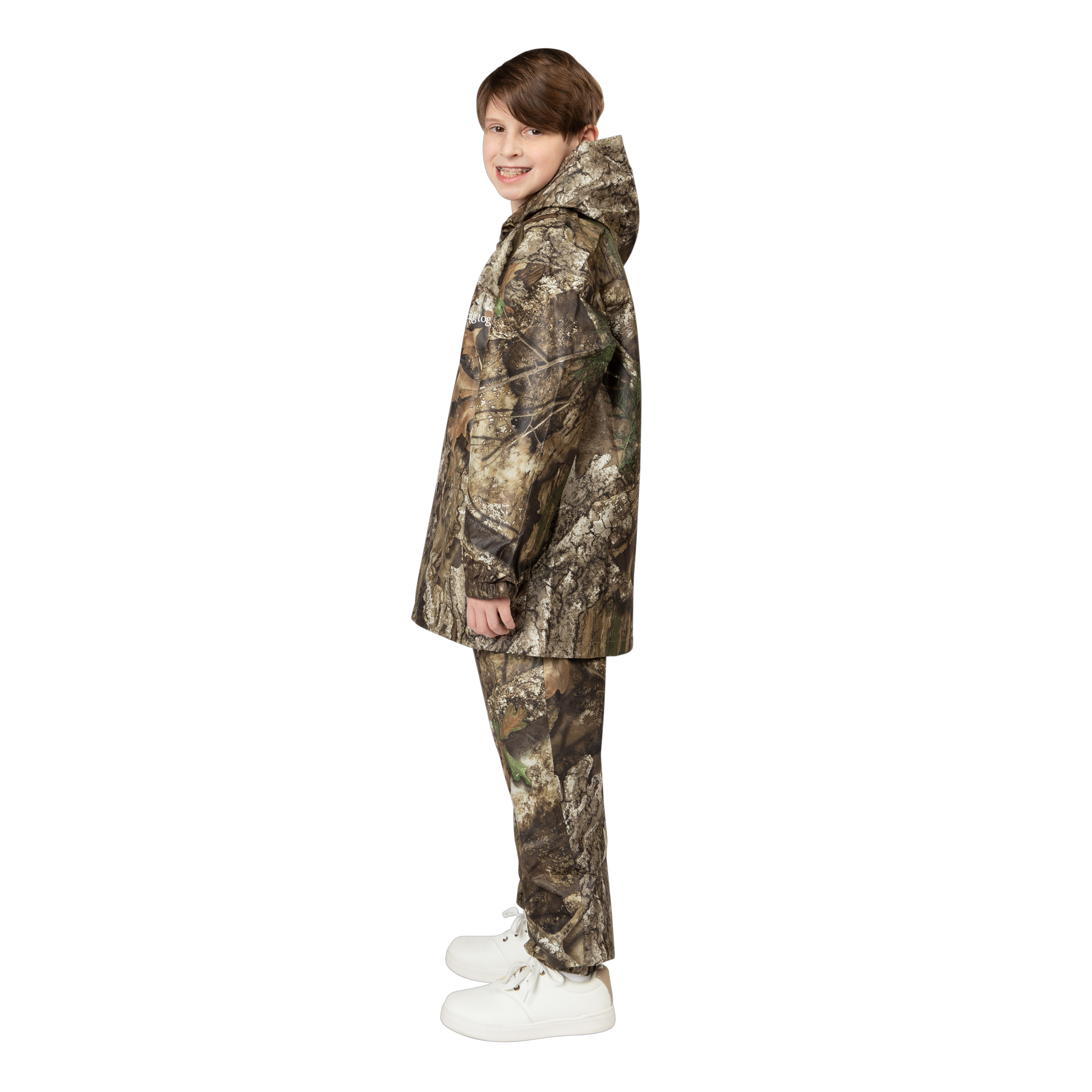 Child wearing a camouflage jacket and pants on a white background