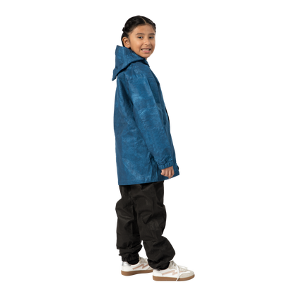 Child wearing a blue raincoat on a white background