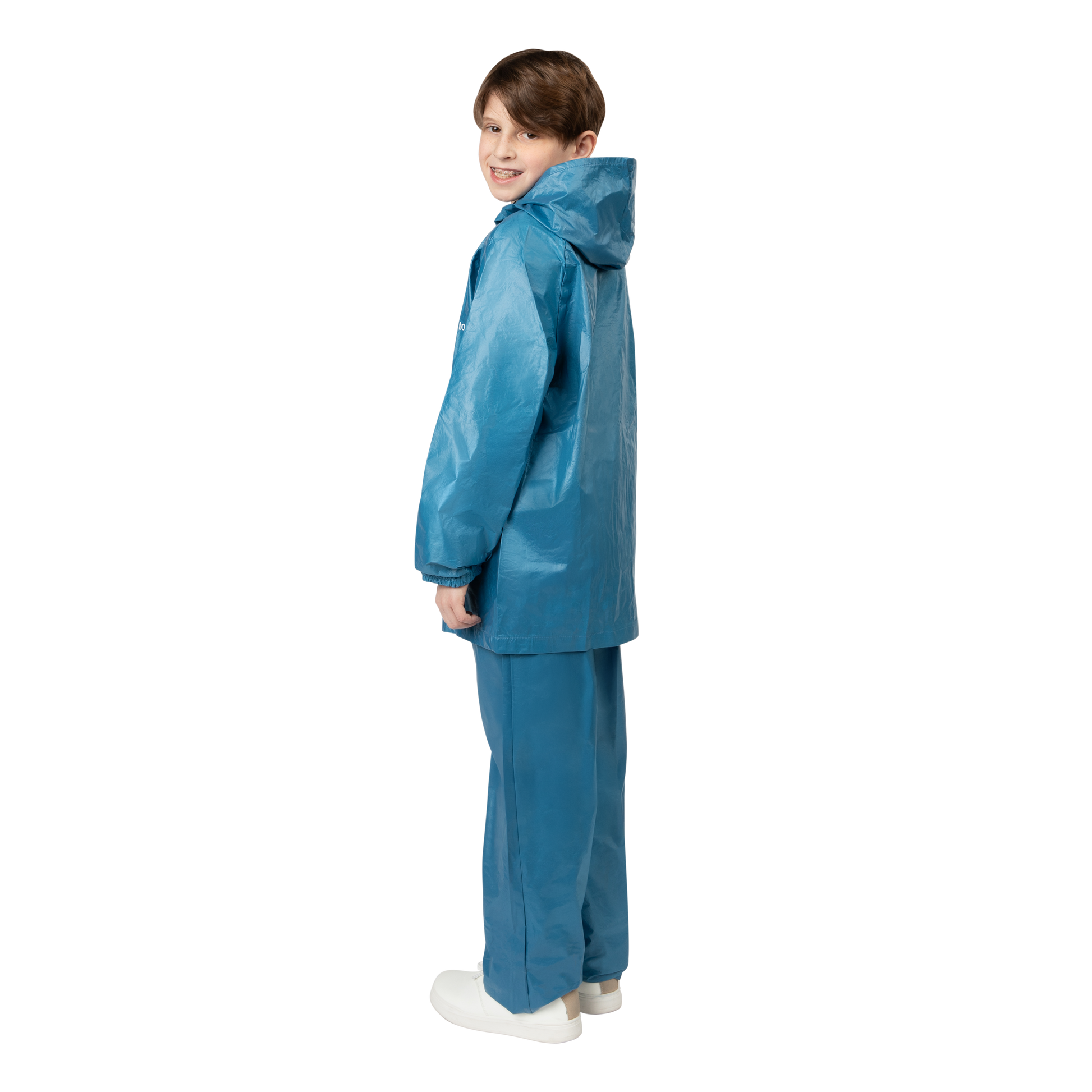 Child wearing a blue raincoat and pants on a white background