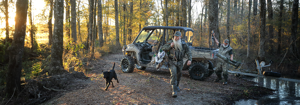 Hunters with a dog in the woods 
